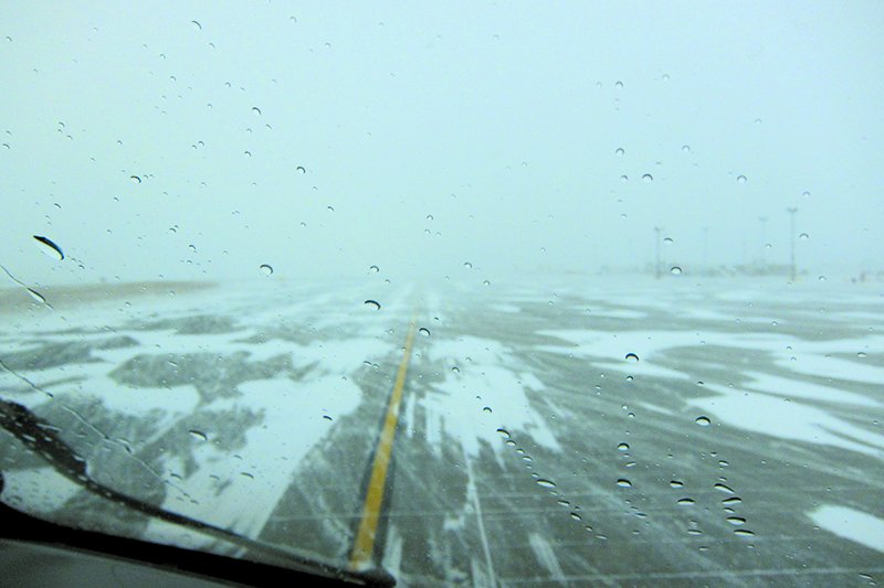 blowing snow on runway